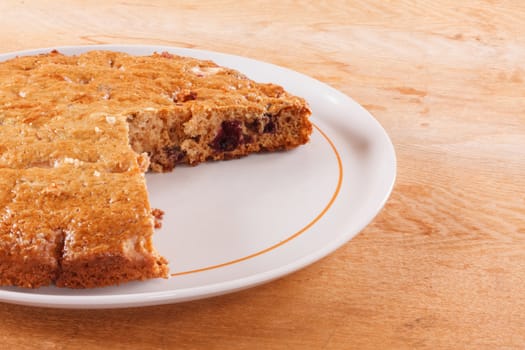 Homemade Cake With Cut Piece On Wooden Table