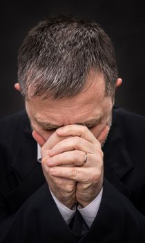 Pain. Elderly man covers his face with hand