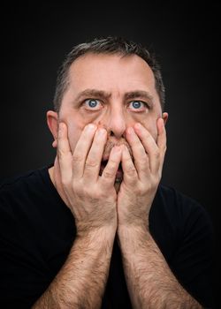 Headache. Portrait of an elderly man with face closed by hand