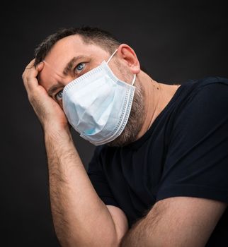 Portrait of sick old man in medical mask