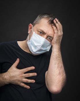 Portrait of sick old man in medical mask