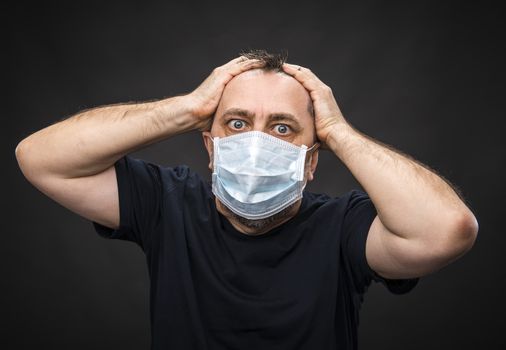 Portrait of sick old man in medical mask