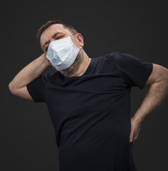 Portrait of sick old man in medical mask