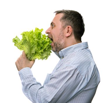 Healthy food. Man holding lettuce isolated on white