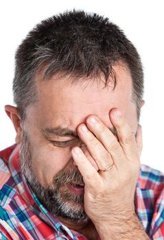 Elderly man suffering from a headache. Isolated on white