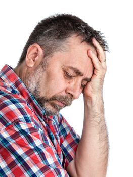 Headache. Portrait of an middle age man with face closed by hand. Isolated on white