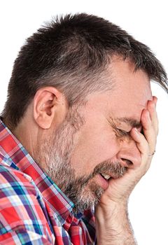 Elderly man suffering from a headache. Isolated on white