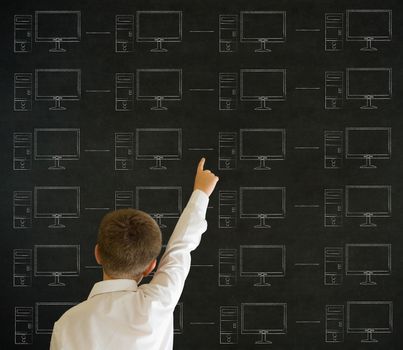 Pointing boy with chalk networks on blackboard background