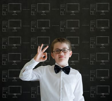 Ok hand signal boy with chalk networks on blackboard background