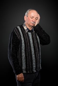 elderly man suffering from a toothache