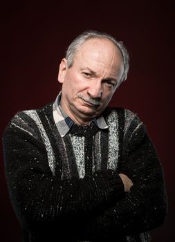 Portrait of handsome senior man with a tired expression