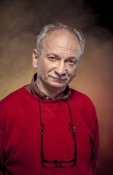 Portrait of an elderly man wearing red jacket