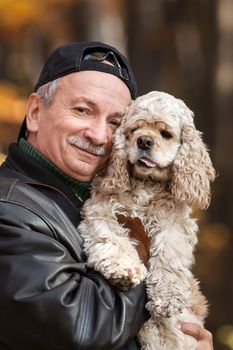 Old man with dog in the forest