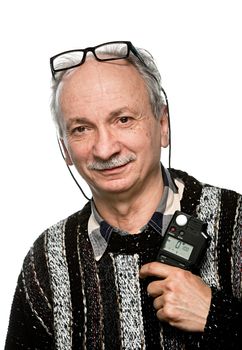 Portrait of a senior photographer with a flash meter and glasses