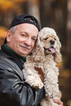 Old man with dog in the forest