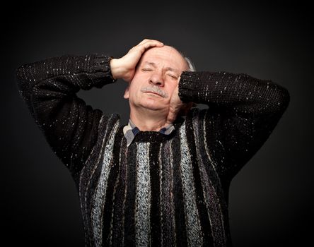  Elderly man suffering from a headache