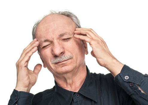 Elderly man suffering from a headache isolated on white