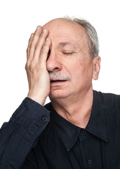 Pain. Elderly man suffering from a headache isolated on white