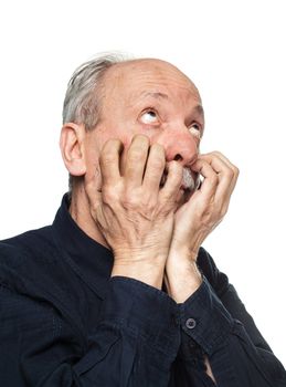 Elderly man suffering from a headache isolated on white