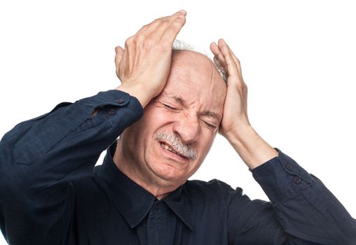 Pain. Elderly man suffering from a headache isolated on white