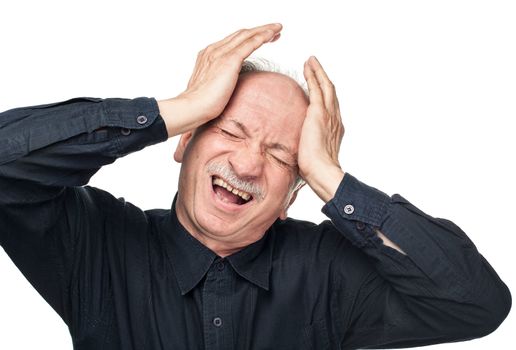 Elderly man suffering from a headache isolated on white