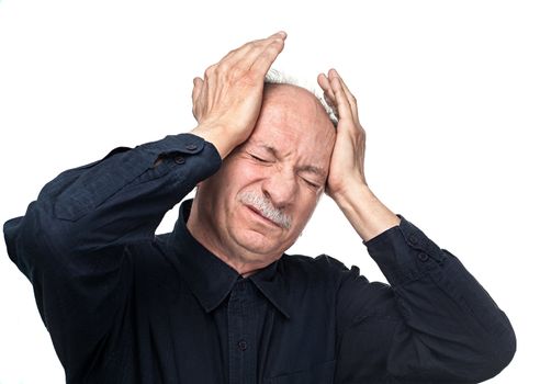 Elderly man suffering from a headache isolated on white