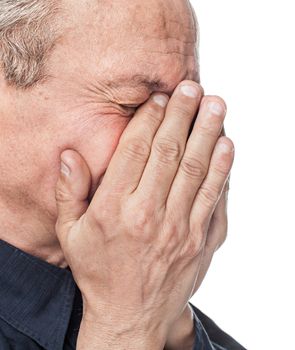 Portrait of an elderly man with face closed by hand