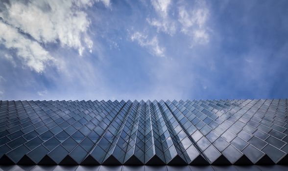 Abstract shot of glass building and blue sky