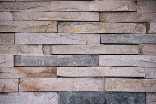 Background shot of layered brown stone wall