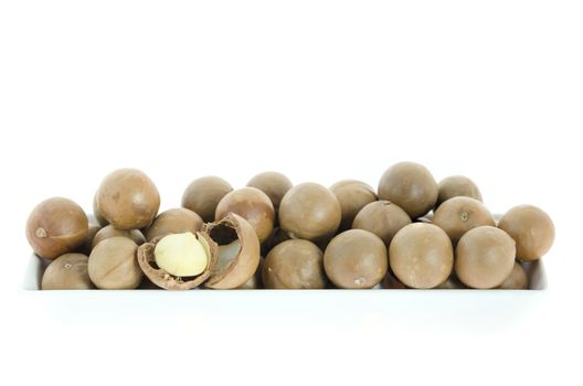 macadamia in  white bowl  on white background