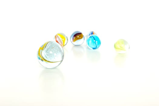 Colourful marbles on white background
