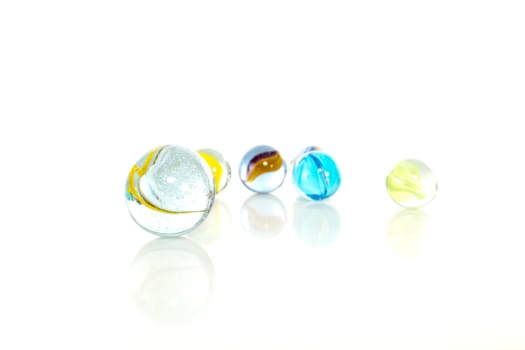 Colourful marbles on white background