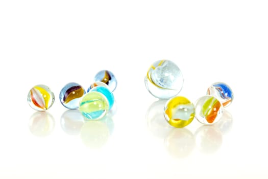 Colourful marbles on white background