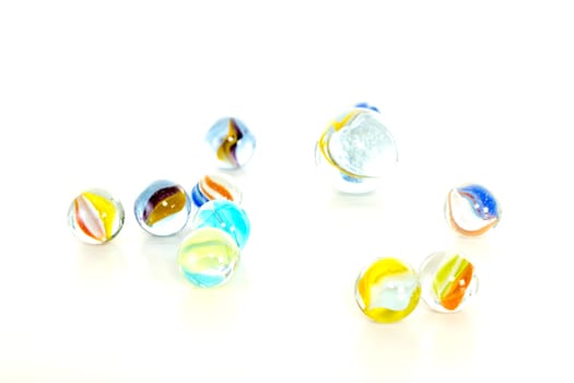 Colourful marbles on white background