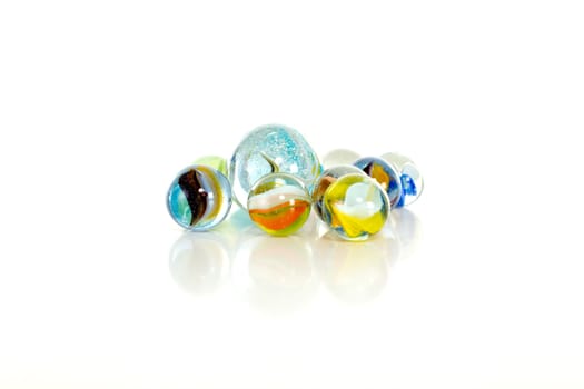 Colourful marbles on white background