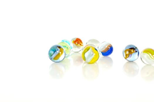 Colourful marbles on white background
