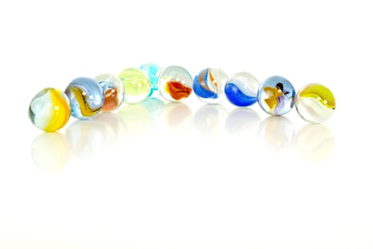 Colourful marbles on white background