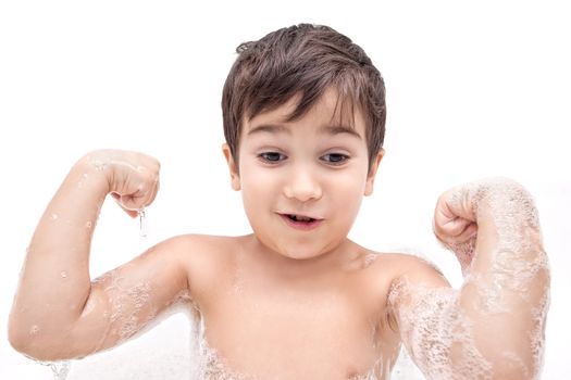 Boy washing in the bathroom and shows muscles