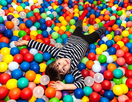 Little boy playing with balls