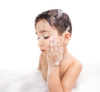 Boy washing in the bathroom