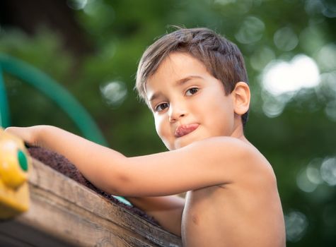 Full of emotion 3-4 years boy playing on the playground