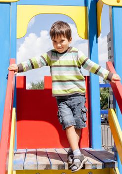 cute boy standing on playground