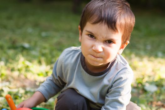 Angry little boy. Focus primarily on the eyes