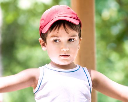 Portrait of a  3-4 years boy playing on the playground