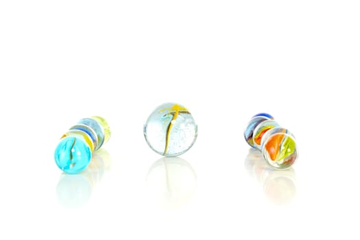 Colourful marbles on white background