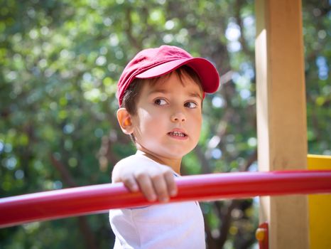 Portrait of a  3-4 years boy playing on the playground