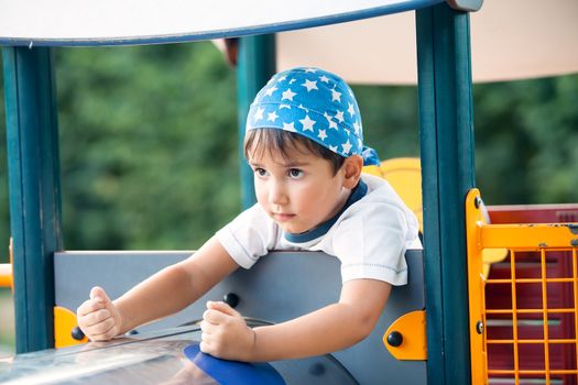 Portrait of a  3-4 years boy playing on the playground