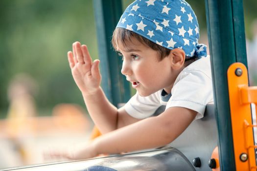 Portrait of a  3-4 years boy playing on the playground