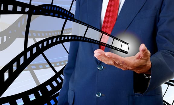 Film strip in businessman hand, Movie industrial