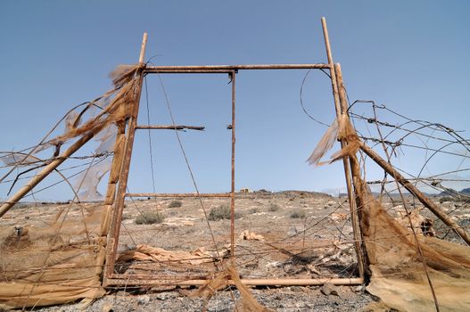 Rusty Ancien Gate over the Desert, in Canary Islands, Spain